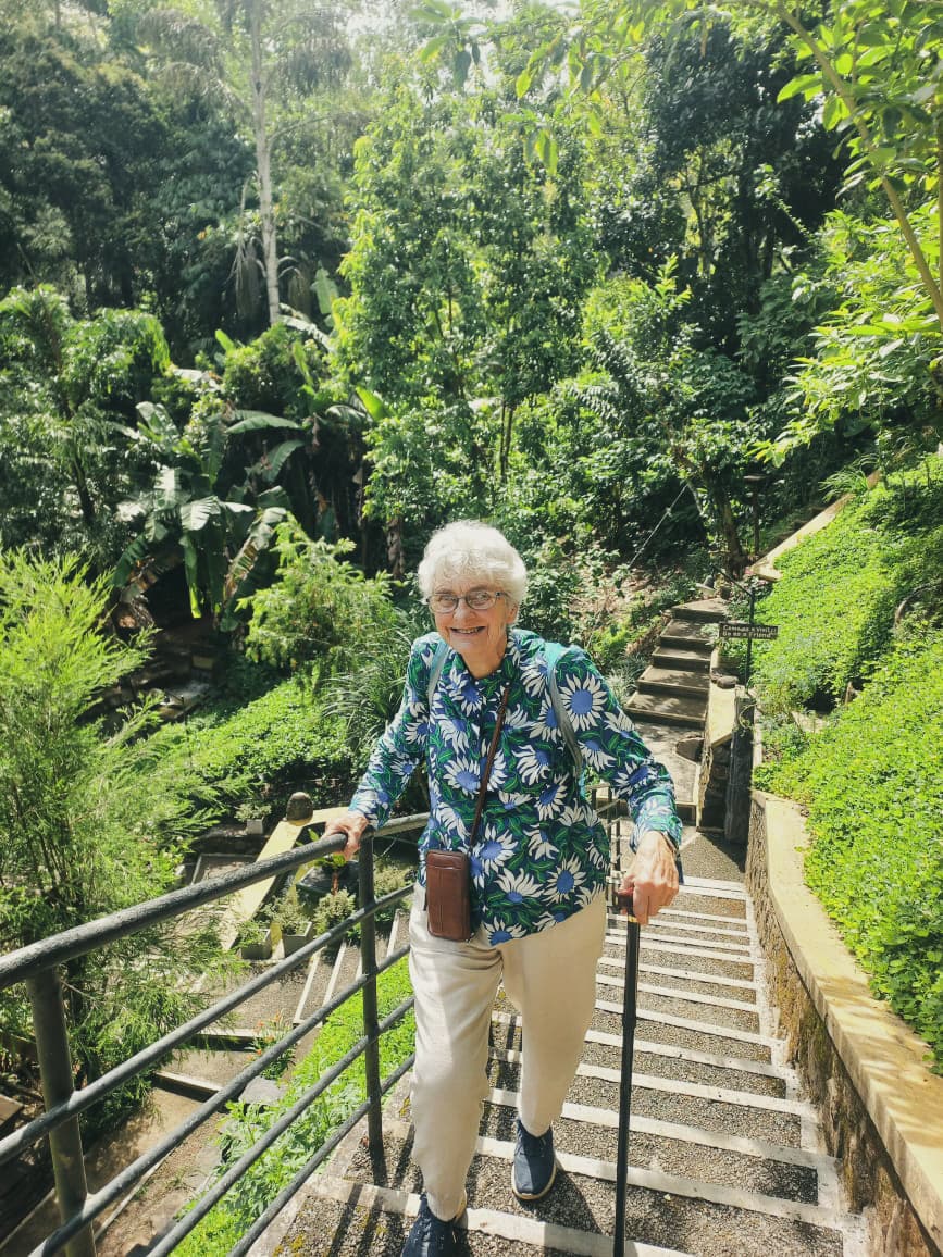 Traveller walking along the historic Ceylon railway through the hills