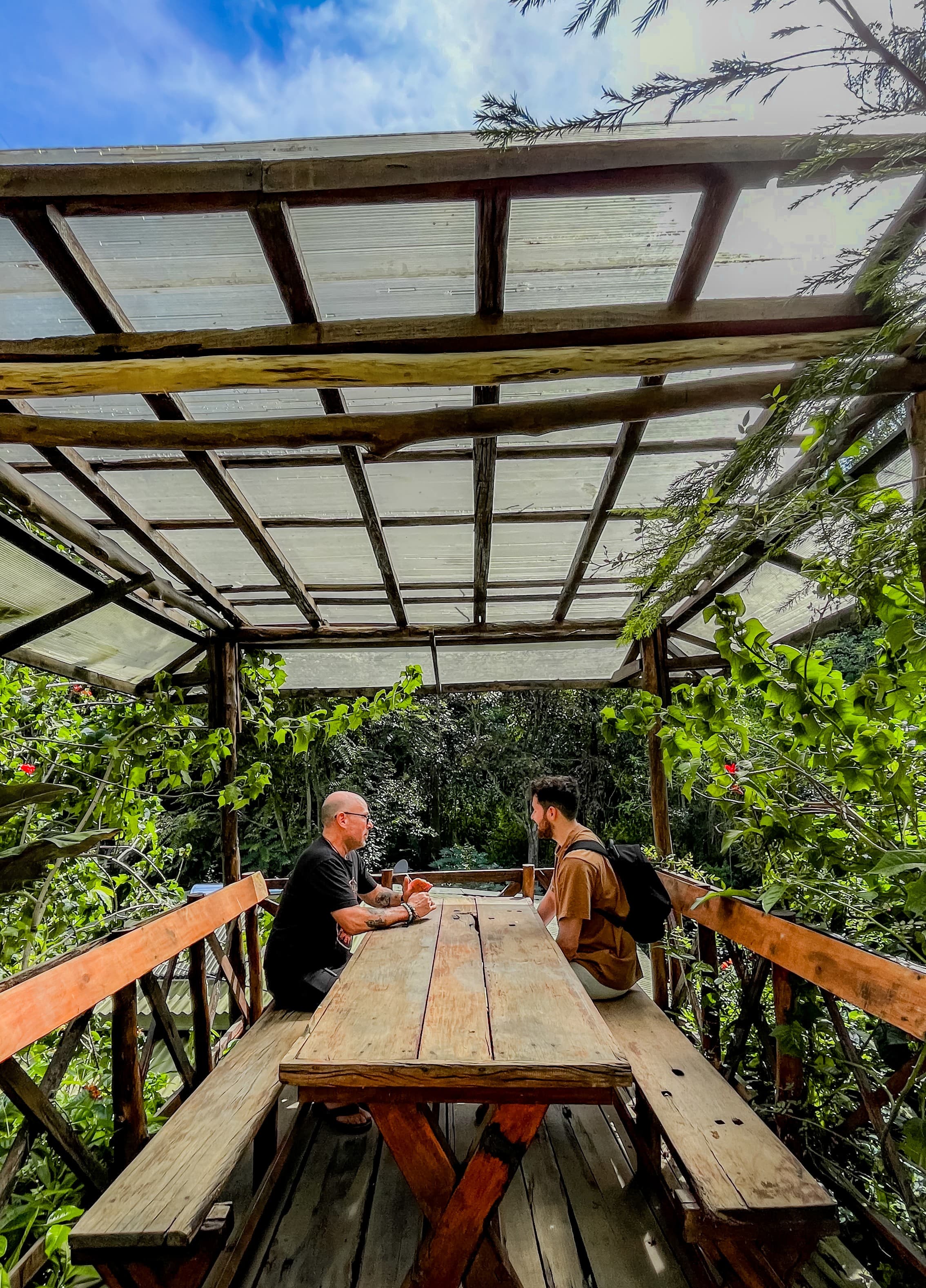 Guests relaxing on the garden dining terrace